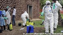 FILE - In this file photo taken Thursday, May 31, 2018, Congolese health officials prepare to disinfect people and buildings at the general referral hospital in Mbandaka, Congo. Congo's Health Minister Oly Ilunga Kalenga on Tuesday July 24, 2018, declared the end of the country's latest deadly outbreak of the Ebola virus, after a 42-day observation period with no new confirmed cases recorded. (AP Photo/John Bompengo, FILE) |