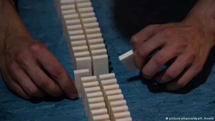 Someone lays titles down at a domino world record attempt in Nidda