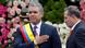 Colombia's new President Ivan Duque salutes to the audience after receiving the presidential sash from President of the Senate Ernesto Macias, during his inauguration ceremony at the Bolivar Square, in Bogota Colombia's new President Ivan Duque salutes to the audience after receiving the presidential sash from President of the Senate Ernesto Macias, during his inauguration ceremony at the Bolivar Square, in Bogota