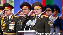 Belarus President Alexander Lukashenko (C) salutes during a military parade marking Independence Day in Minsk on July 3, 2018. - The former Soviet nation celebrates its Independence Day on July 3 in memory of the end of Belarus occupation by Nazi Germany troops during the Red Army main summer offensive in 1944. (Photo by Sergei GAPON / AFP) (Photo credit should read SERGEI GAPON/AFP/Getty Images)
