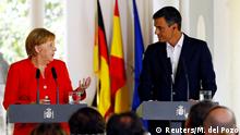 Spain's Prime Minister Pedro Sanchez stands next to German Chancellor Angela Merkel during a joint statement in Sanlucar de Barrameda, Spain August 11, 2018. REUTERS/Marcelo del Pozo