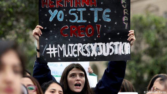 A demonstrator holds up a sign that reads Sister, I believe you in Lima, Peru, on August 11, 2018