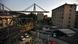 A general view shows apartment buildings under the Morandi motorway bridge in background one day after a section collapsed in Genoa A general view shows apartment buildings under the Morandi motorway bridge in background one day after a section collapsed in Genoa