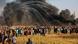Palstinians gather during clashes with Israel in Gaza Palstinians gather during clashes with Israel in Gaza