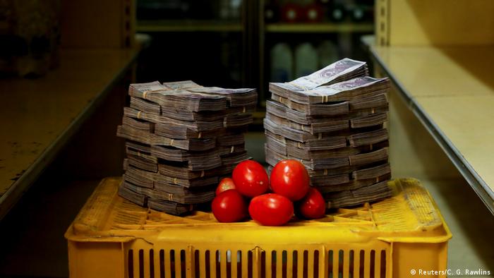 A kilogram of tomatoes is pictured next to 5,000,000 bolivars