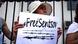 Woman holding poster with "Free Sentsov" written on it Woman holding poster with "Free Sentsov" written on it
