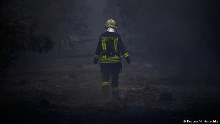 A firefighter at the scene of a forest fire near Treuenbrietzen, just outside Berlin