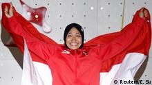 Sport Climbing – 2018 Asian Games – Women's Speed, Medal Ceremony – JSC Sport Climbing, Palembang, Indonesia – August 23, 2018 – Gold medalist Susanti Rahayu Aries of Indonesia celebrates on the podium. REUTERS/Edgar Su