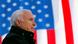 US Senator John McCain with a US flag in the background US Senator John McCain with a US flag in the background