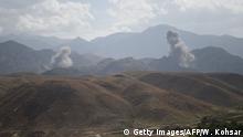 In this photo taken on July 7, 2018, smoke rises after an air strike bomb on Islamic State (IS) militants positions in a checkpoint at the Deh Bala district in the eastern province of Nangarhar Province. - A US soldier was killed and two others wounded in an apparent insider attack in southern Afghanistan on July 8, NATO said, the first such killing in nearly a year. (Photo by WAKIL KOHSAR / AFP) (Photo credit should read WAKIL KOHSAR/AFP/Getty Images)