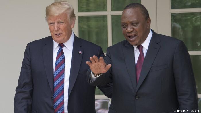 Kenya's President Uhuru Kenyatta stands next to US President Donald Trump