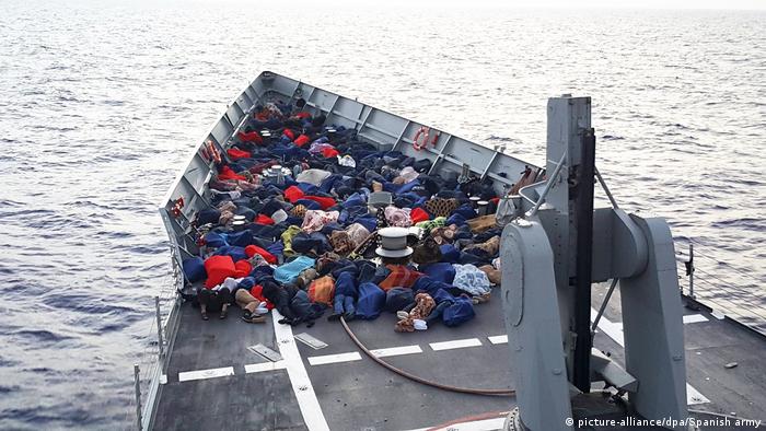 Rescued migrants on a boat 