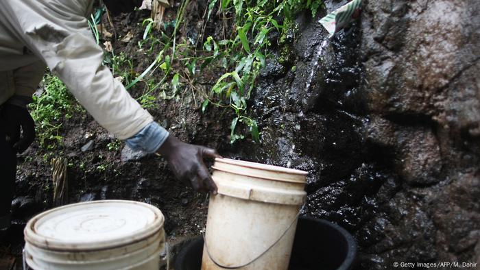 A man fetching water.