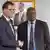 German development minister Gerd Müller shakes hands with Zimbabwe's former finance minister Patrick Chinamasa
