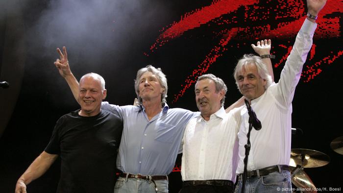 The four members of Pink Floyd soak up applause on stage