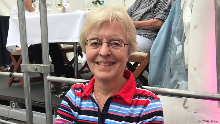 Beethovenfest 2018 (DW/R. Fulker) Middle aged woman wearing a striped, colorful shirt, smiles at the camera in Bonn main square.