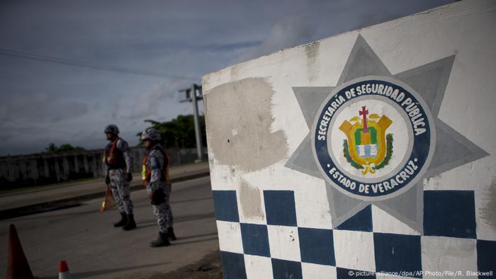 Veracruz state police stand at roadblock along the highway