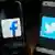 Smartphones mit Facebook and Twitter Logos