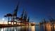 A container ship docks in the dusk at Hamburg Port A container ship docks in the dusk at Hamburg Port