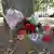 شمع و گل به یاد جوان کشته شده در محل درگیری در شهر کوتن