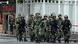 Chinese paramilitary police patrol a street in Urumqi, the capital of Xinjiang province Chinese paramilitary police patrol a street in Urumqi, the capital of Xinjiang province