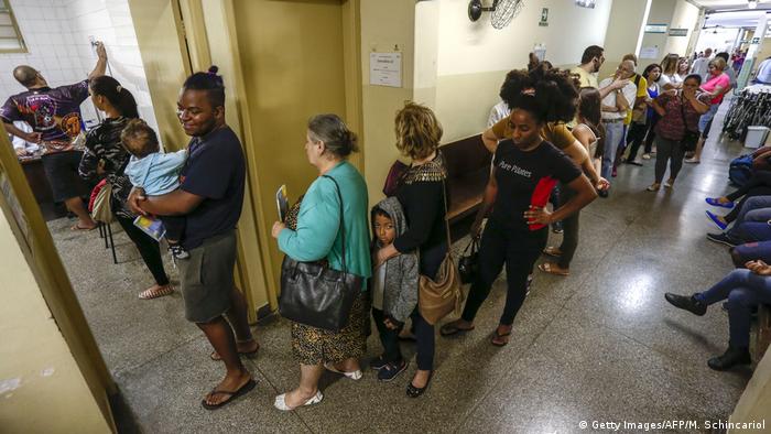 People queueing in Sao Paulo clinic