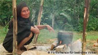Ashaninka woman at campfire in the rainforest