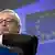 European Commission President Jean-Claude Juncker checks his watch