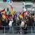 Demonstrators holding up German flags march through Chemnitz on Friday