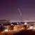 Syrian air defenses intercept missile over Damascus