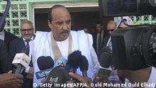 1.9.2018***
Mauritanian President Mohamed Ould Abdel Aziz gives a press point after casting his vote on September 1, 2018 at a polling station in Nouakchott for the country's legislative, regional and local elections. - Mauritania, a frontline state in the fight against Islamic extremism, voted on September 1 in legislative, regional and local elections that will test head of state Mohamed Ould Abdel Aziz's record seven months before a presidential vote. Military personnel cast their ballots Friday to free themselves up to provide security in the vast and arid west African state with a registered electorate of some 1.4 million. (Photo by AHMED OULD MOHAMED OULD ELHADJ / AFP) (Photo credit should read AHMED OULD MOHAMED OULD ELHADJ/AFP/Getty Images)