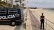 A Spanish police officer patrols near an empty beach and close to the scene of a bomb that exploded in Palma de Majorca, Spain, Sunday, Aug. 9, 2009. A Spanish police officer patrols near an empty beach and close to the scene of a bomb that exploded in Palma de Majorca, Spain, Sunday, Aug. 9, 2009.