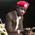 Ugandan pop star and opposition politician Bobi Wine next to a crutch he had to use after being severely beaten