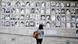 A woman looks at a wall of photographs showing victims of Chile's dictatorship A woman looks at a wall of photographs showing victims of Chile's dictatorship