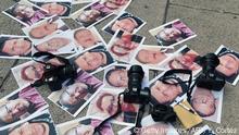 TOPSHOT - Cameras and pictures of journalists recently murdered in different Mexican states are placed at Independence Angel square during a protest by journalists in Mexico City on May 16, 2017. - Mexico ranks third in the world for the number of journalists killed, after Syria and Afghanistan, according to media rights group Reporters Without Borders (RSF). (Photo by YURI CORTEZ / AFP) (Photo credit should read YURI CORTEZ/AFP/Getty Images)