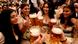 Visitors holding glasses of beer at the Oktoberfest Visitors holding glasses of beer at the Oktoberfest
