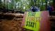 A sign in Hambach forest saying "Stay Forest Stay!" A sign in Hambach forest saying "Stay Forest Stay!"