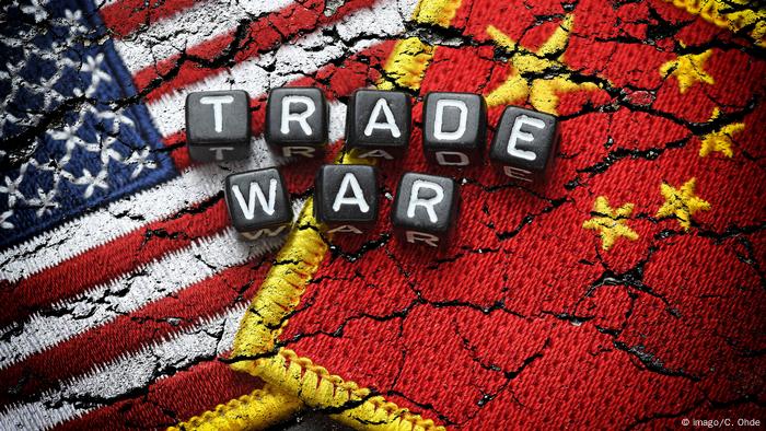 Flags of the US and China with the words Trade War