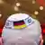 Person wearing a kippa embroidered with the German and Israeli flags