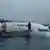 Plane half-sunk in lagoon