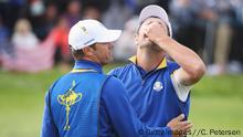 PARIS, FRANCE - SEPTEMBER 30: Jon Rahm of Europe celebrates winning his match with caddie Adam Hayes during singles matches of the 2018 Ryder Cup at Le Golf National on September 30, 2018 in Paris, France. (Photo by Christian Petersen/Getty Images)
