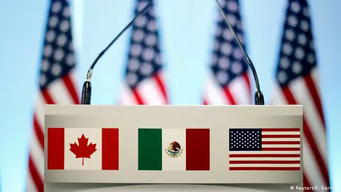 US, Canadian and Mexican flags (Reuters/E. Garrido)