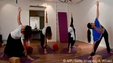 Saudi women practice yoga at a studio in the western Saudi Arabian city of Jeddah on September 7, 2018. - Widely perceived as a Hindu spiritual practice, yoga was not officially permitted for decades in Saudi Arabia, the cradle of Islam where all non-Muslim worship is banned. But with Crown Prince Mohammed bin Salman vowing an open, moderate Islam, the kingdom last November recognised yoga as a sport, despite the risk of riling hardliners opposed to the practice. (Photo by Amer HILABI / AFP) (Photo credit should read AMER HILABI/AFP/Getty Images)