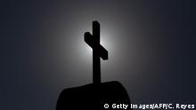 30.07.2018
Picture of a cross taken in Punta de Tralca, west of Santiago, on July 30, 2018 as Chile's Episcopal Conference holds an extraordinary meeting to analyze the roots of the current crisis that the Catholic Church is experiencing in the country, burdened by the scandals of sexual abuse and cover-up, and how to overcome it. - Chile is investigating more than 150 members of the country's embattled Catholic Church -- both clergymen and lay people -- for perpetrating or concealing the sexual abuse of children and adults, prosecutors said last week. (Photo by CLAUDIO REYES / AFP) (Photo credit should read CLAUDIO REYES/AFP/Getty Images)