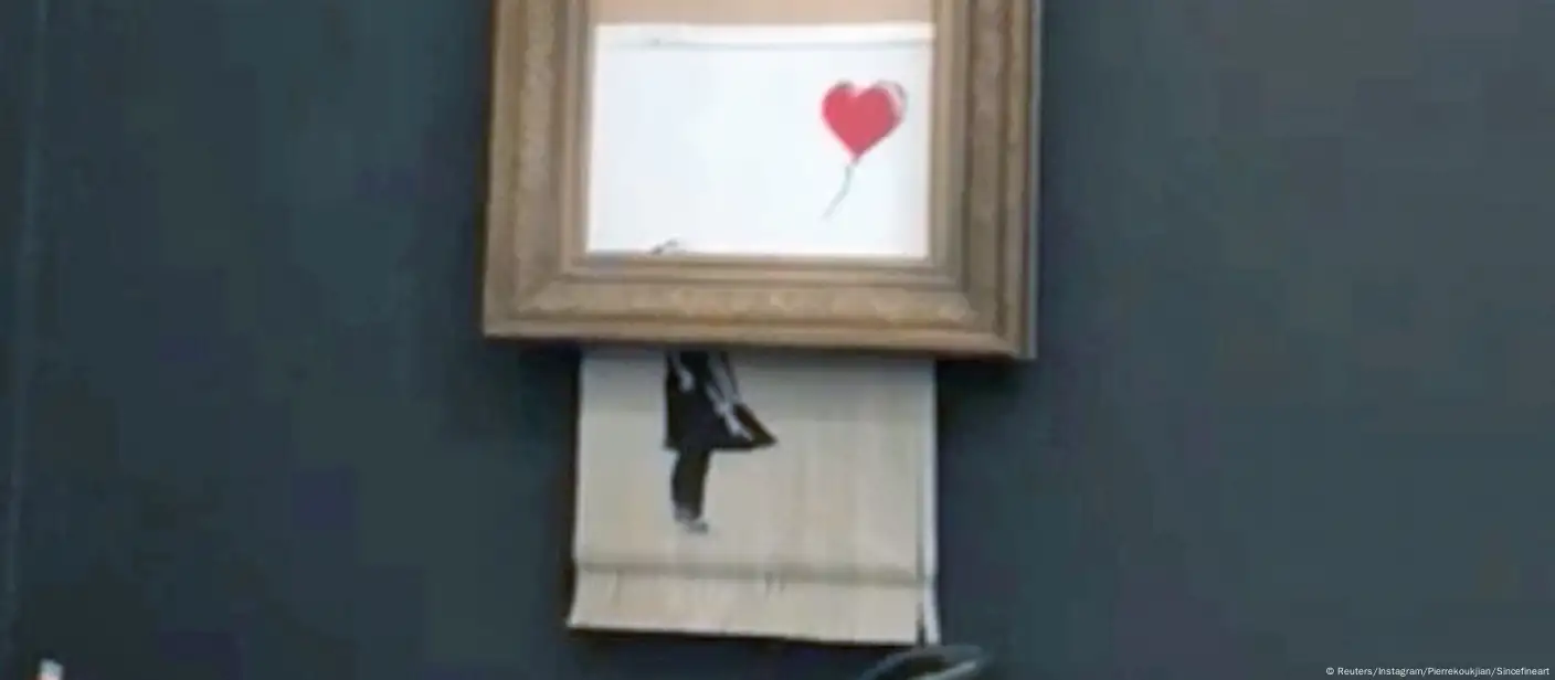 Banksy artwork self-destructs at auction – DW – 10/06/2018