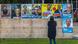 A woman stands in front of a wall of campaign posters for the state election in Bavaria A woman stands in front of a wall of campaign posters for the state election in Bavaria