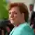 Bundeskanzlerin Merkel mit vom Wind verwehten Haar