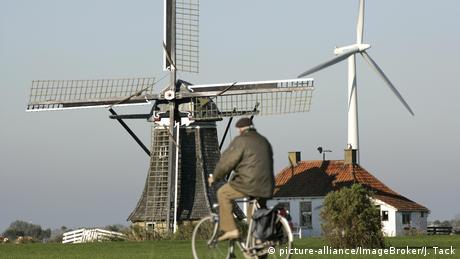 Windmill and wind turbine in the Netherlands