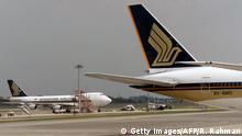This photograph taken on September 4, 2016 shows a Singapore Airlines planes parked on the tarmac of Changi International Airport in Singapore. / AFP / ROSLAN RAHMAN (Photo credit should read ROSLAN RAHMAN/AFP/Getty Images)