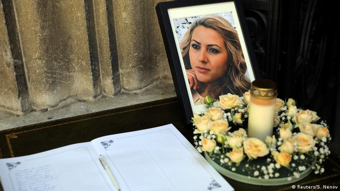 A photo of murdered Bulgarian journalist Viktoria Marinova sits next to a condolence book before her funeral service in Ruse